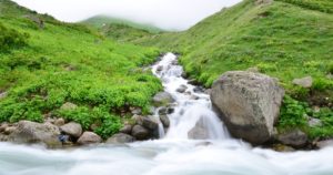 stream of water flowing to a cloud