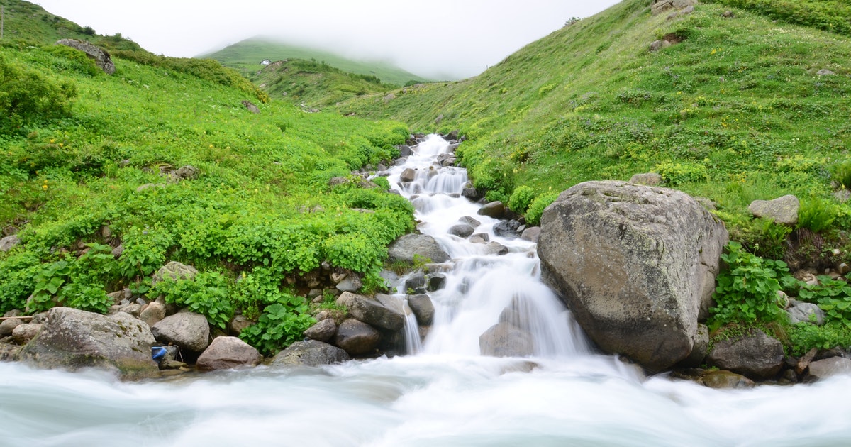 stream of water flowing to a cloud